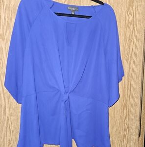 Bold elements cut to curve blouse